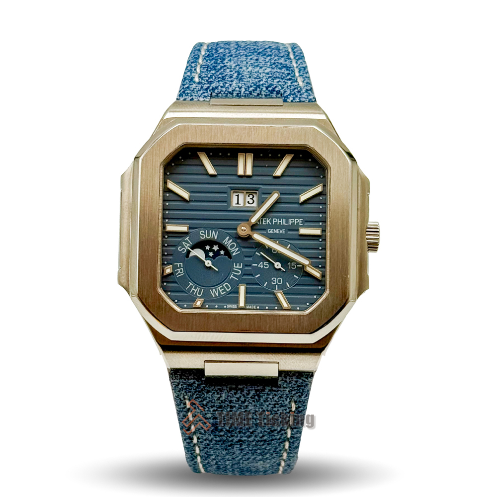 Patek Philippe Cubitus men’s Master Grade Replica watch with a sunburst blue dial and denim strap.