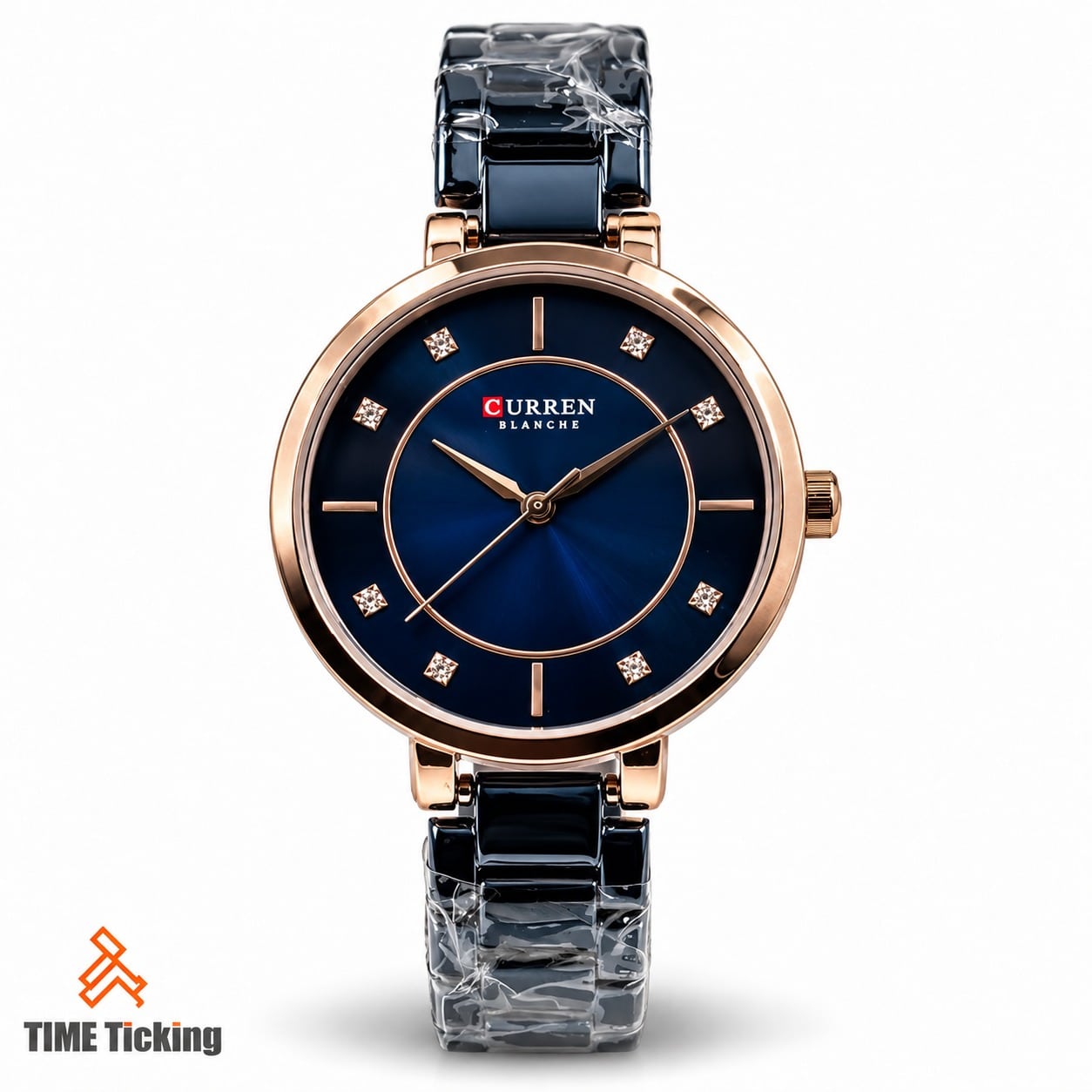 CURREN 9054 women's watch featuring a deep blue sunray dial, rose gold-tone case and hour markers, and a glossy dark blue bracelet.