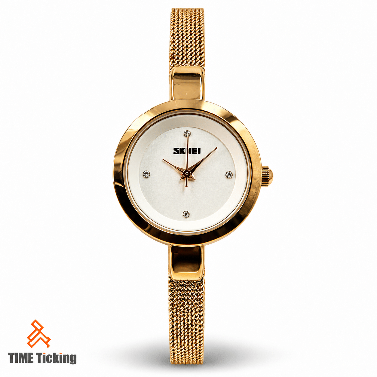 SKMEI 1390 gold women’s watch featuring a white round dial, gold-tone case, crystal-style hour markers, and stainless steel mesh bracelet strap.